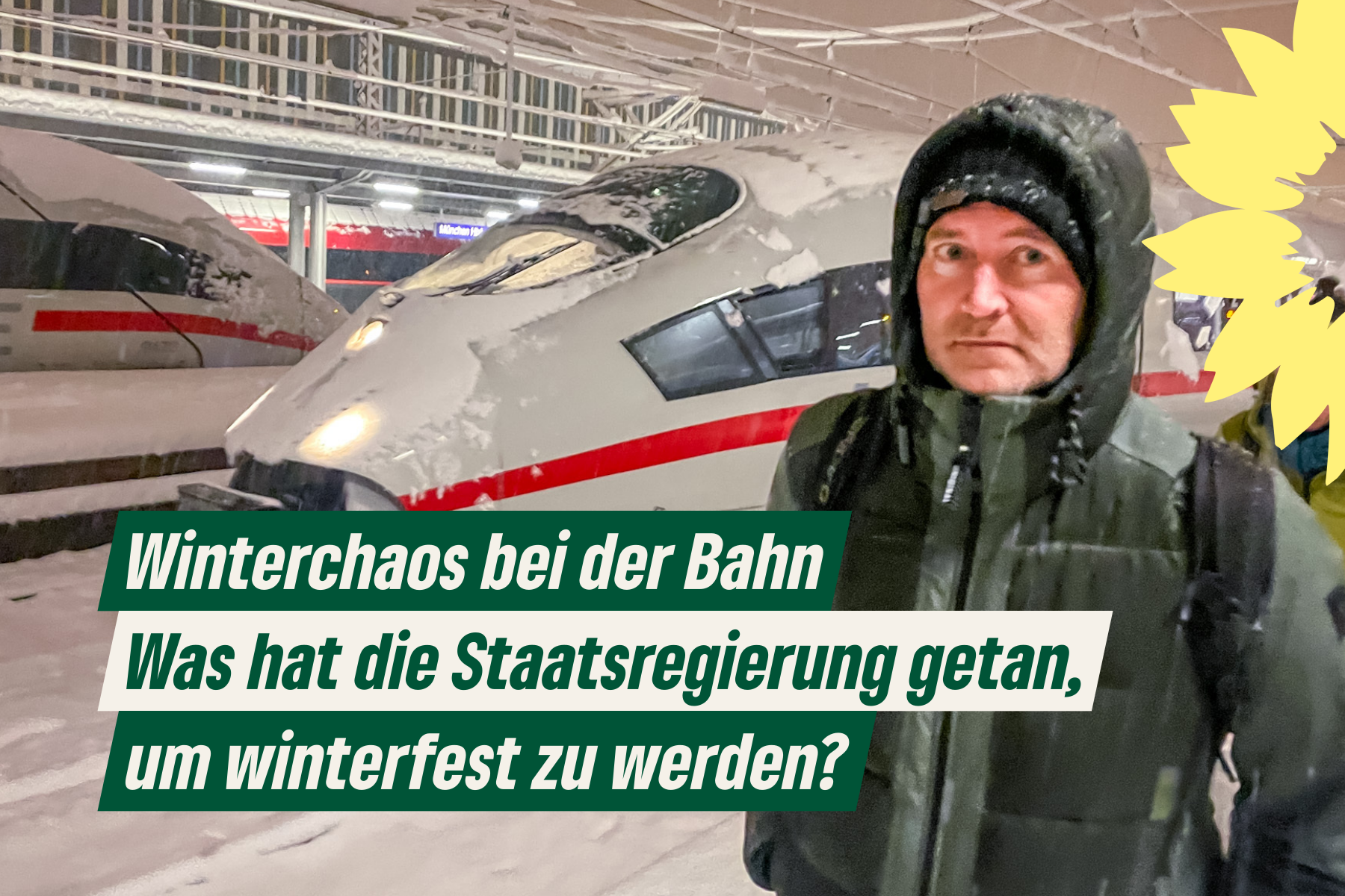 Markus Büchler in Winterjacke vor verschneitem ICE am Münchner Hauptbahnhof mit Text: Winterchaos bei der Bahn - Was hat die Staatsregierung getan, um winterfest zu werden?